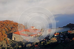 Beautiful panoramic view of the monastery of san esteban de rivas de sil with a sea of Ã¢â¬â¹Ã¢â¬â¹fog around it covering the entire photo